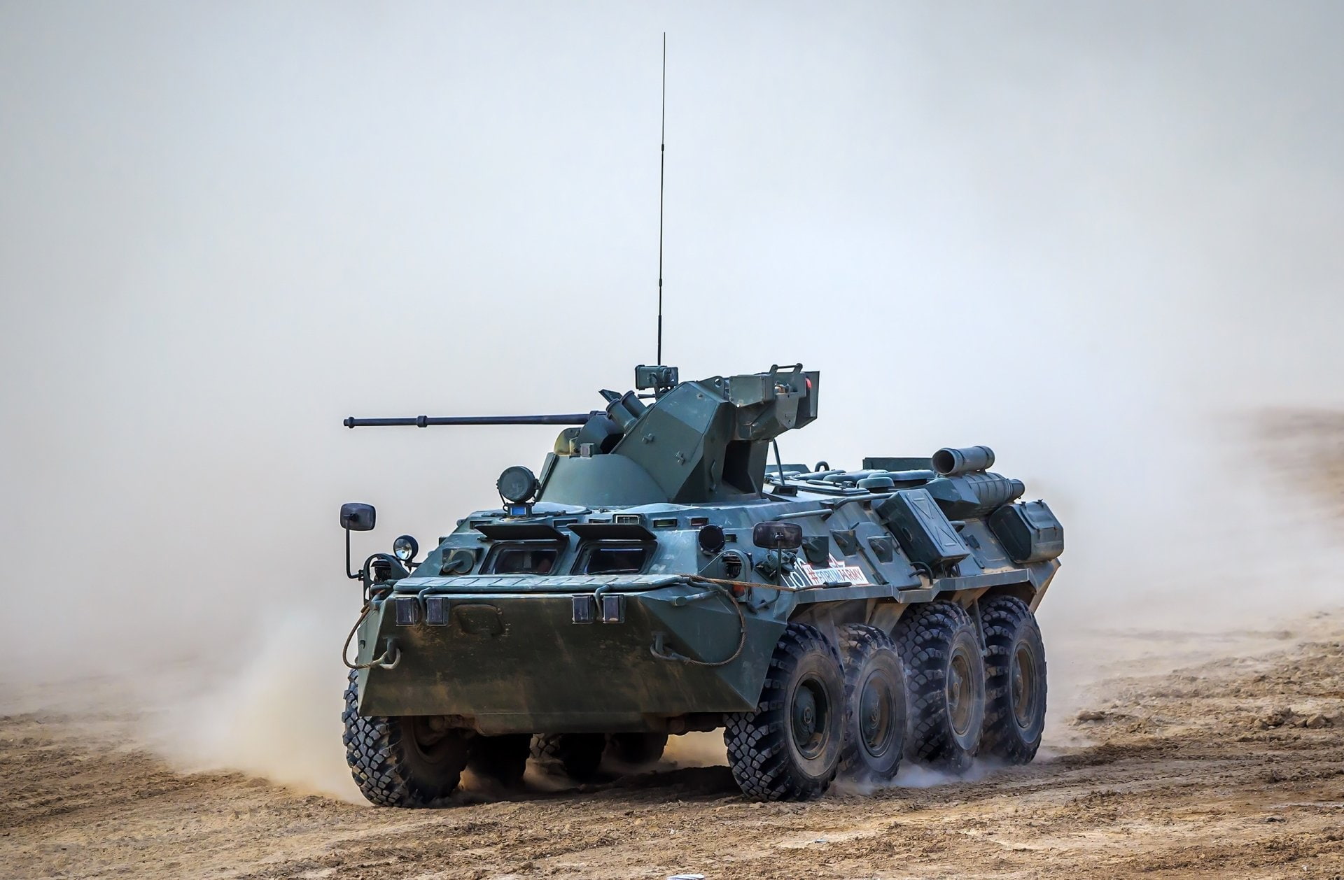 Armoured vehicle in dust