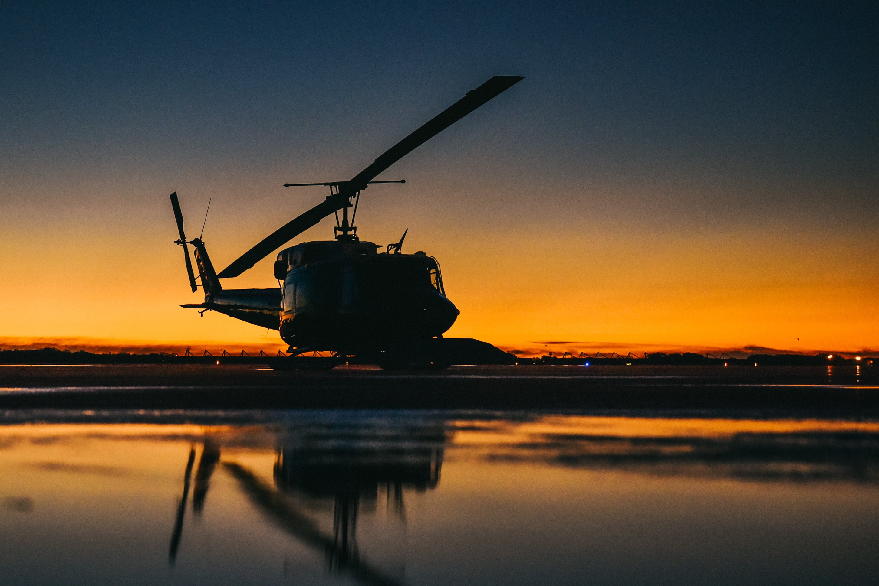 Rotary-wing aircraft on the ramp at dusk